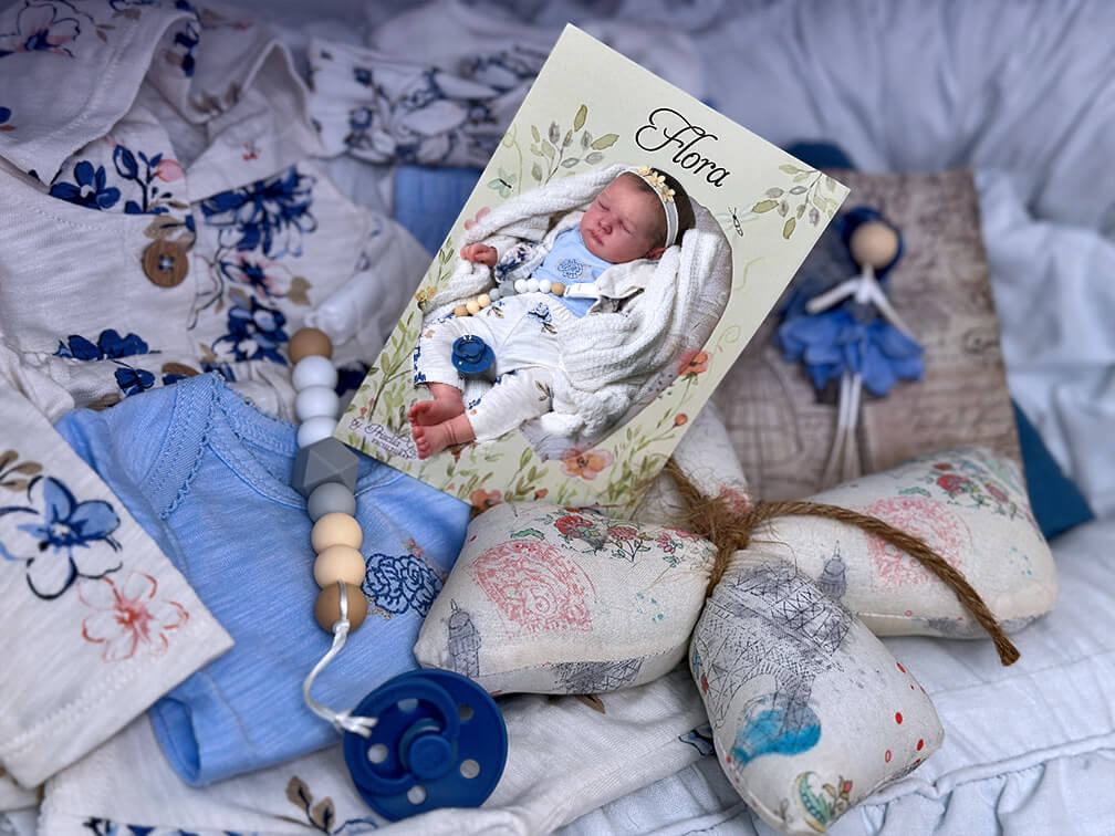Reborn Flora by sculpter Priscilla Lopez with a very blue themed box packing.